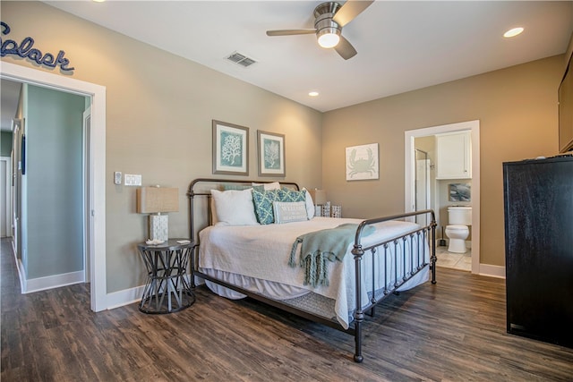 bedroom with dark hardwood / wood-style flooring, ceiling fan, and ensuite bath