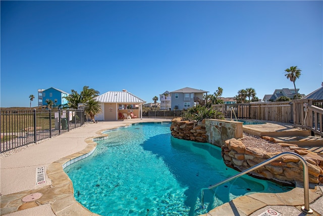 view of swimming pool with a patio area