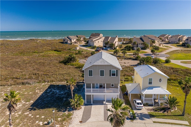 aerial view with a beach view and a water view