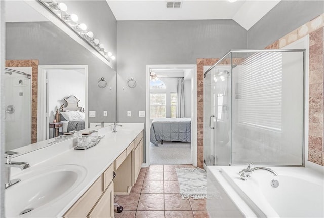 bathroom with ceiling fan, tile patterned flooring, vaulted ceiling, vanity, and independent shower and bath