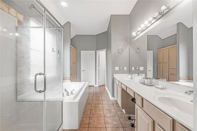 bathroom featuring tile patterned flooring, vanity, and independent shower and bath