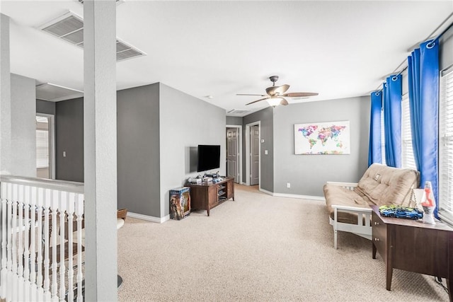 living room with carpet flooring and ceiling fan