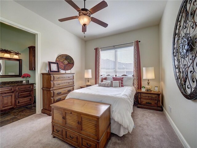 8409 Lago Vista Dr, Corpus Christi, TX 78414 - carpeted bedroom with a ceiling fan, baseboards, and connected bathroom