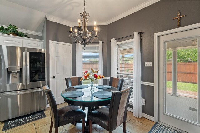 7425 Bourget Dr, Corpus Christi, TX 78413 - dining area featuring light tile patterned floors, a chandelier, ornamental molding, and baseboards