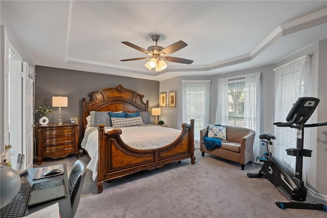 7425 Bourget Dr, Corpus Christi, TX 78413 - carpeted bedroom with a tray ceiling, ceiling fan, and ornamental molding