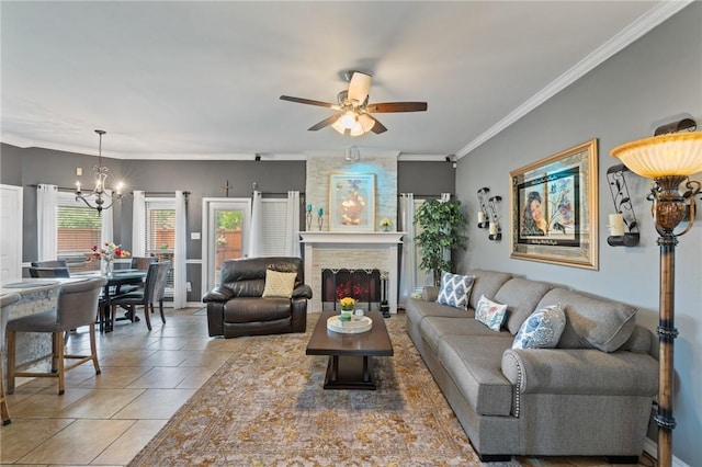 7425 Bourget Dr, Corpus Christi, TX 78413 - living room featuring a chandelier, ceiling fan, crown molding, a fireplace, and tile patterned floors