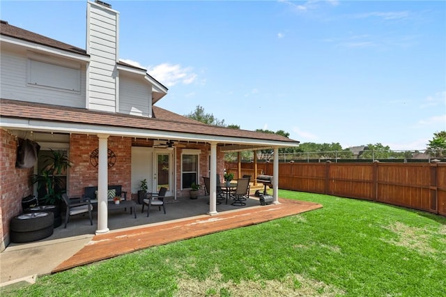7425 Bourget Dr, Corpus Christi, TX 78413 - view of yard featuring ceiling fan, an outdoor living space, and a patio area