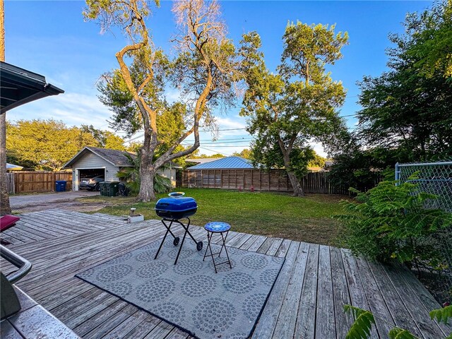 wooden terrace featuring a yard