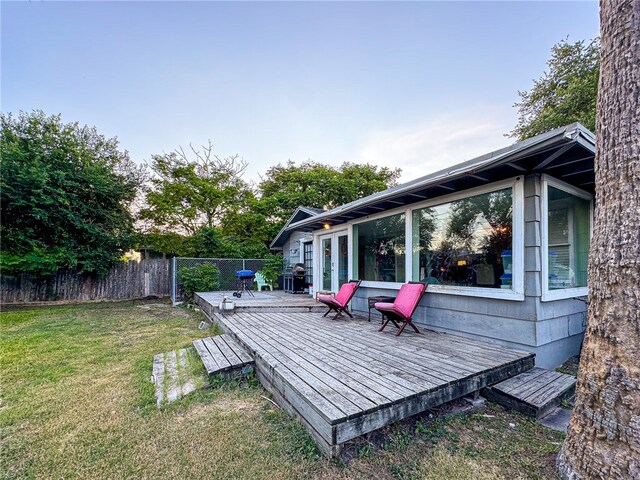 deck featuring a lawn