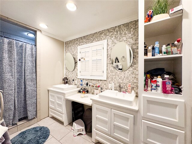 bathroom with walk in shower, vanity, tile patterned floors, and crown molding