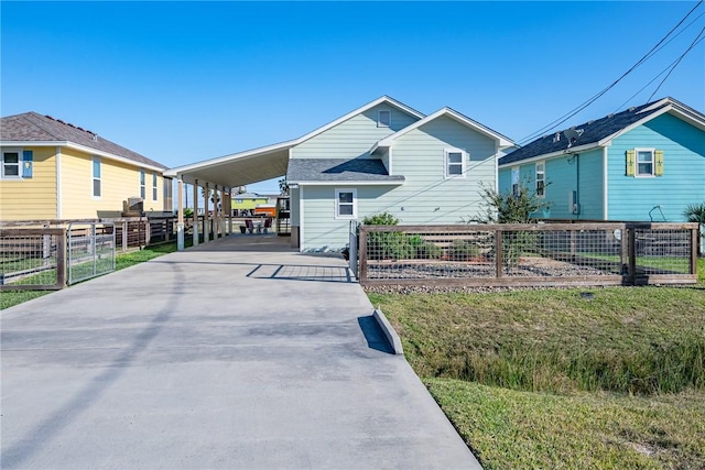 view of front facade with a carport