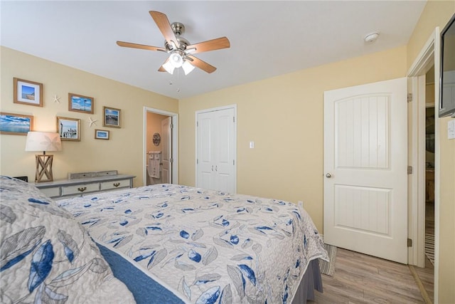 bedroom with ceiling fan, a closet, and light wood-type flooring