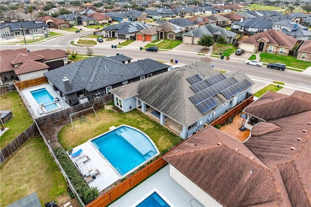 birds eye view of property with a residential view