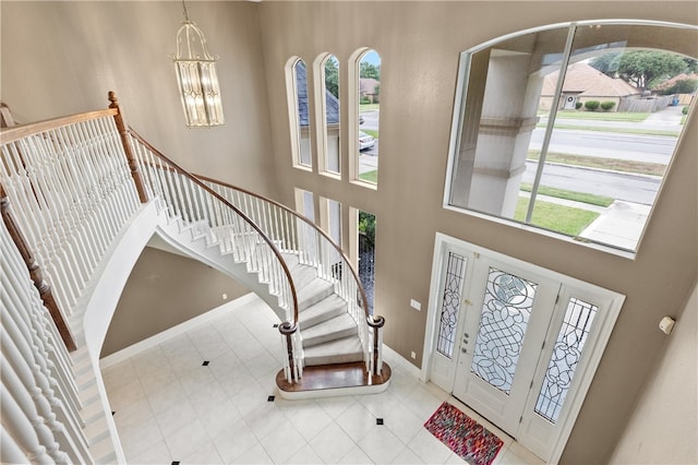 entrance foyer with a high ceiling and a chandelier