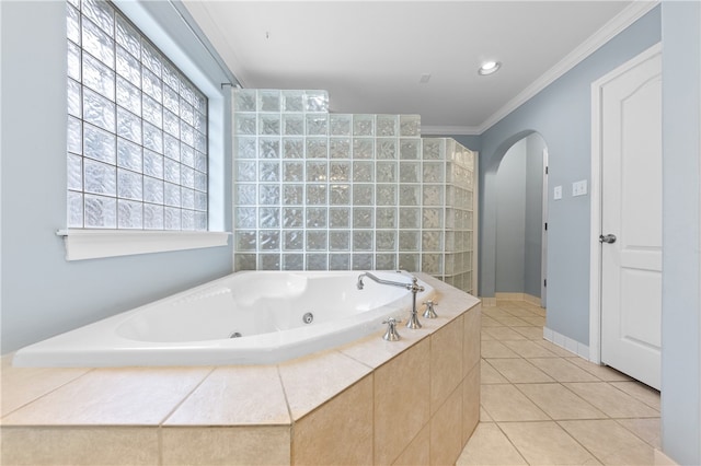 bathroom featuring tiled bath, tile patterned floors, and crown molding