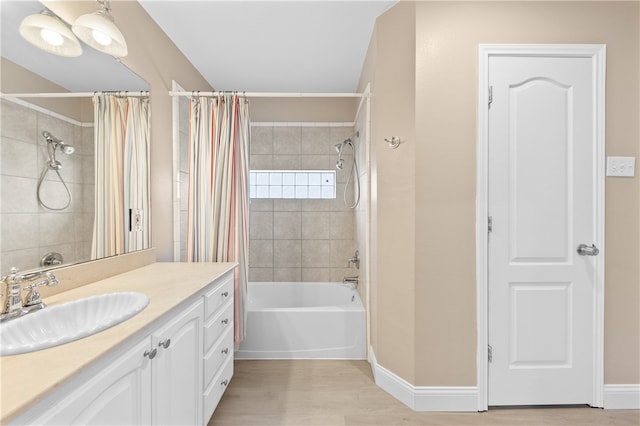 bathroom with vanity, shower / bath combo with shower curtain, and wood-type flooring