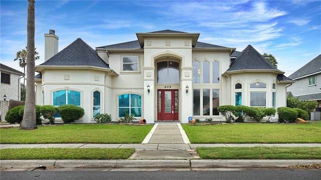 view of front of home with a front lawn