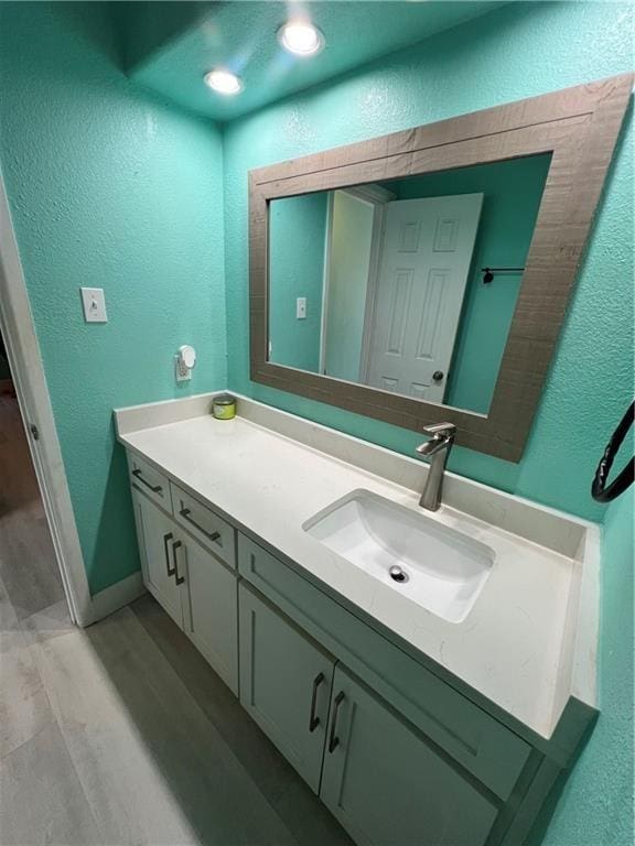 bathroom featuring wood-type flooring and vanity