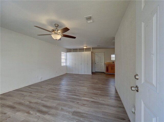 interior space featuring light hardwood / wood-style flooring and ceiling fan