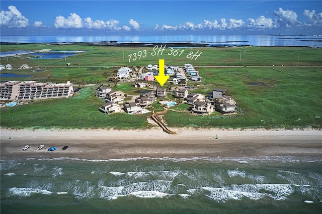 aerial view with a beach view and a water view