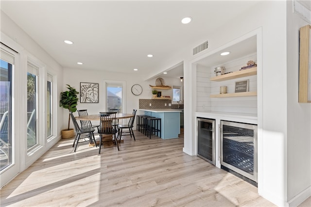 interior space featuring light hardwood / wood-style floors and wine cooler