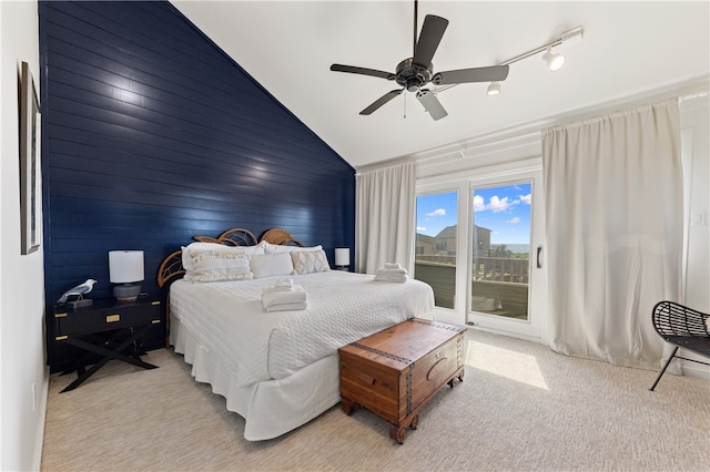 bedroom with light carpet, track lighting, ceiling fan, access to exterior, and lofted ceiling