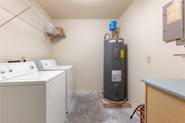 laundry area featuring water heater, electric panel, and washing machine and clothes dryer