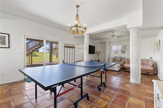 game room with a notable chandelier and ornate columns