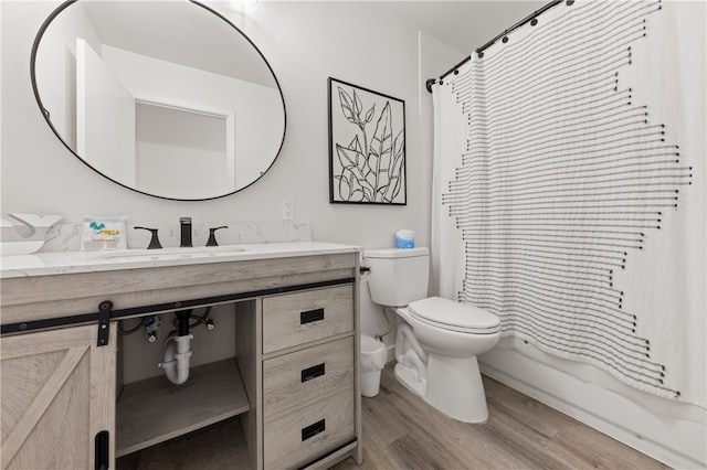 full bathroom with toilet, sink, wood-type flooring, and shower / bathtub combination with curtain