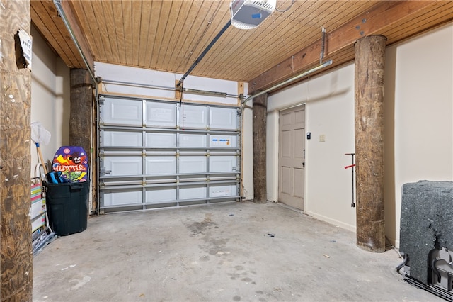 garage with wood ceiling and a garage door opener