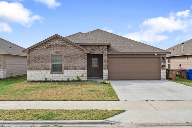 view of front of house featuring brick siding, a front lawn, concrete driveway, roof with shingles, and an attached garage