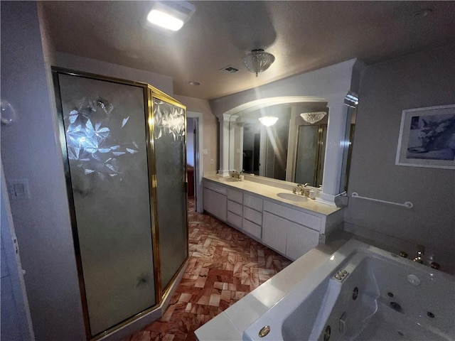 5445 Ocean Dr, Corpus Christi, TX 78412 - full bath with a stall shower, ornate columns, double vanity, and a whirlpool tub