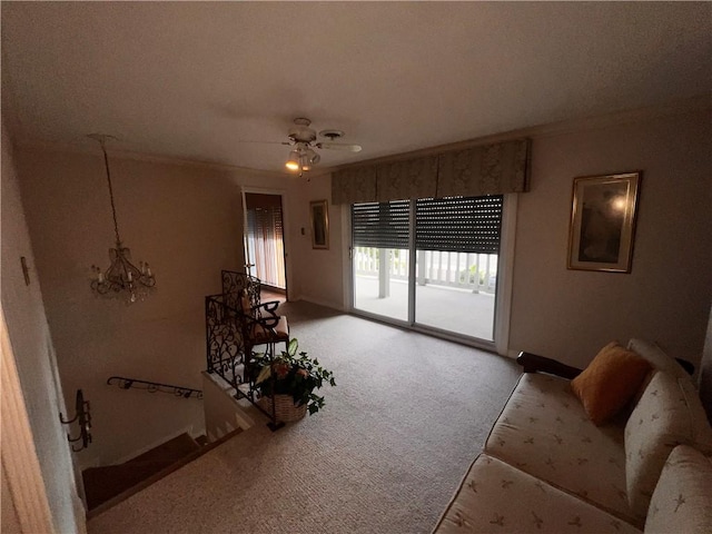 5445 Ocean Dr, Corpus Christi, TX 78412 - carpeted living area featuring a chandelier, crown molding, and ceiling fan