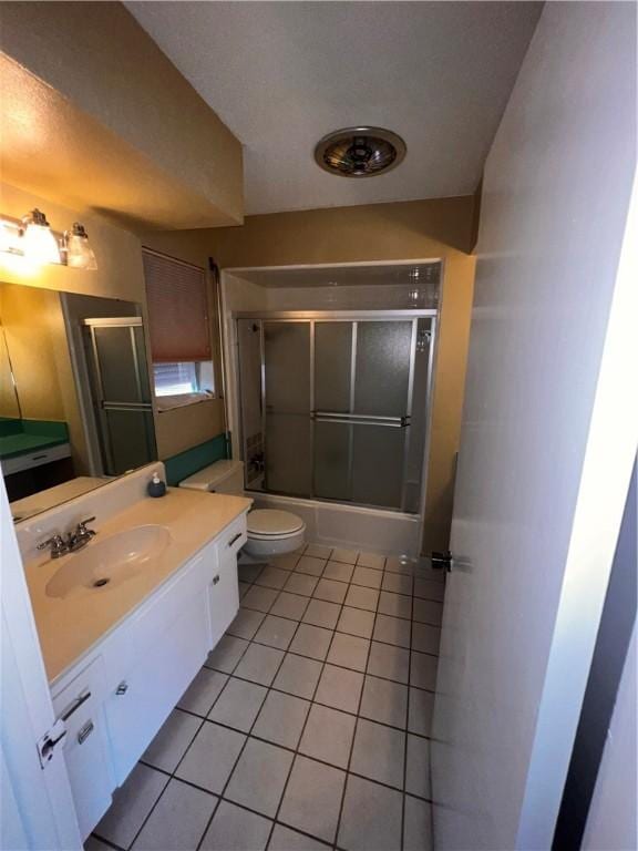 5445 Ocean Dr, Corpus Christi, TX 78412 - bathroom featuring tile patterned floors, vanity, and enclosed tub / shower combo