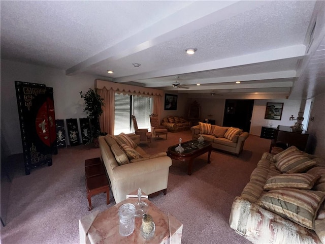 5445 Ocean Dr, Corpus Christi, TX 78412 - carpeted living room featuring beamed ceiling, ceiling fan, and a textured ceiling