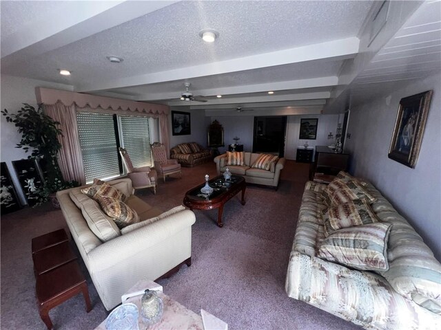 5445 Ocean Dr, Corpus Christi, TX 78412 - carpeted living room with ceiling fan, beamed ceiling, and a textured ceiling