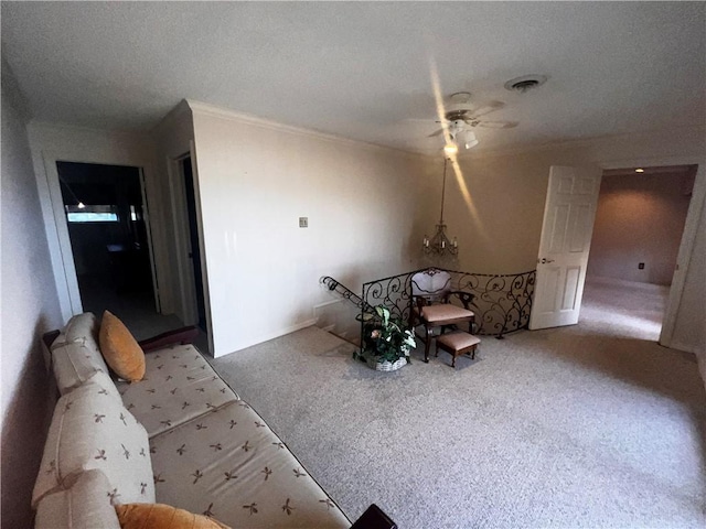 5445 Ocean Dr, Corpus Christi, TX 78412 - living room featuring carpet floors, ceiling fan, crown molding, and a textured ceiling