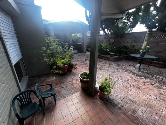 5445 Ocean Dr, Corpus Christi, TX 78412 - fenced backyard with a patio