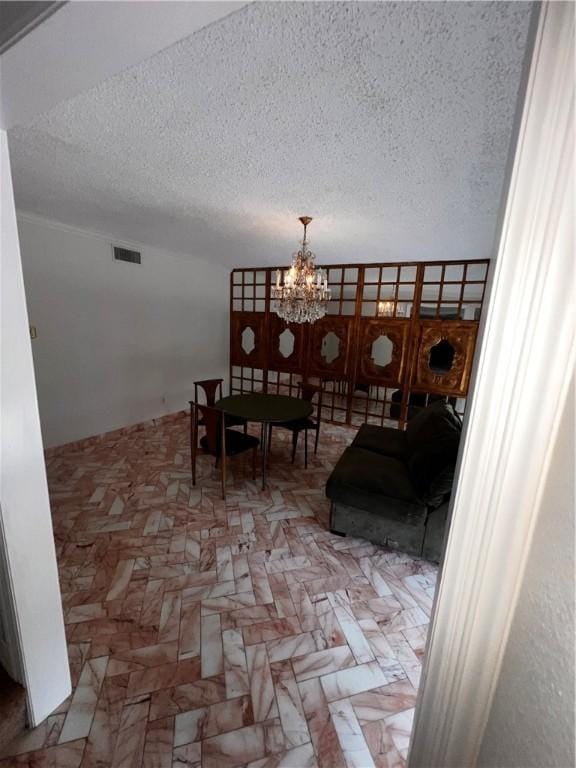 5445 Ocean Dr, Corpus Christi, TX 78412 - dining space featuring a textured ceiling and a chandelier