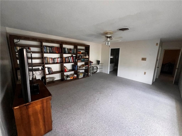 5445 Ocean Dr, Corpus Christi, TX 78412 - interior space with ceiling fan, carpet flooring, and a textured ceiling