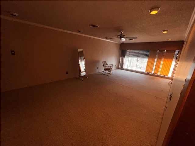 5445 Ocean Dr, Corpus Christi, TX 78412 - carpeted empty room featuring ceiling fan and ornamental molding