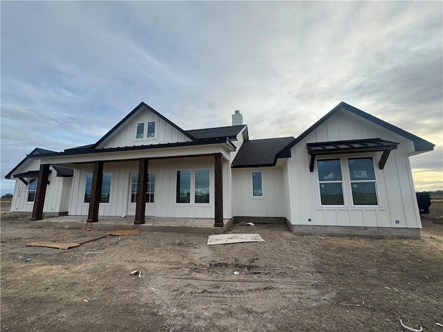 modern farmhouse style home with covered porch