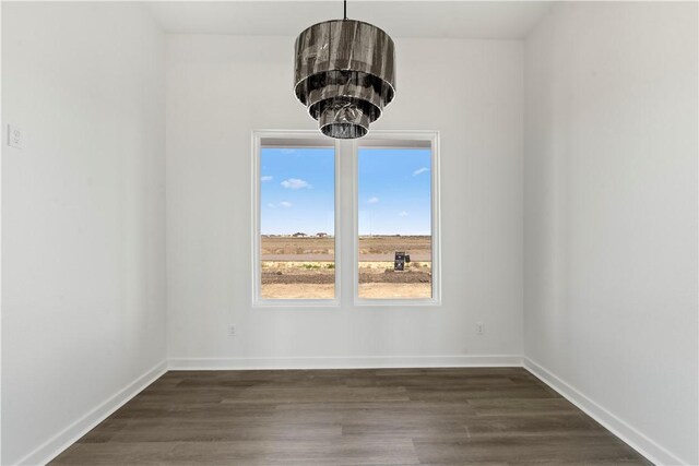 unfurnished living room with high vaulted ceiling, plenty of natural light, and beam ceiling