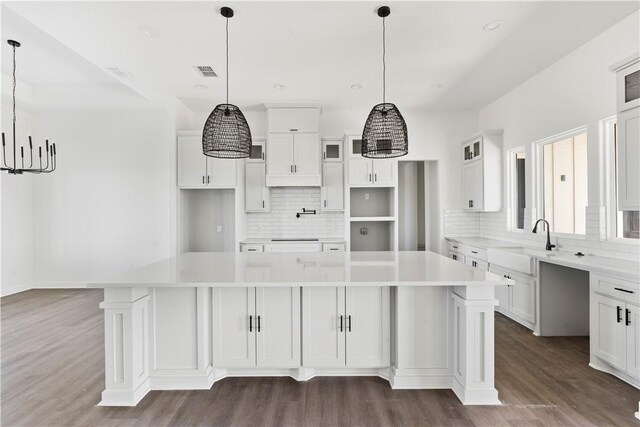 unfurnished room featuring carpet floors, baseboards, and a raised ceiling