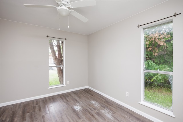 spare room with hardwood / wood-style flooring and ceiling fan