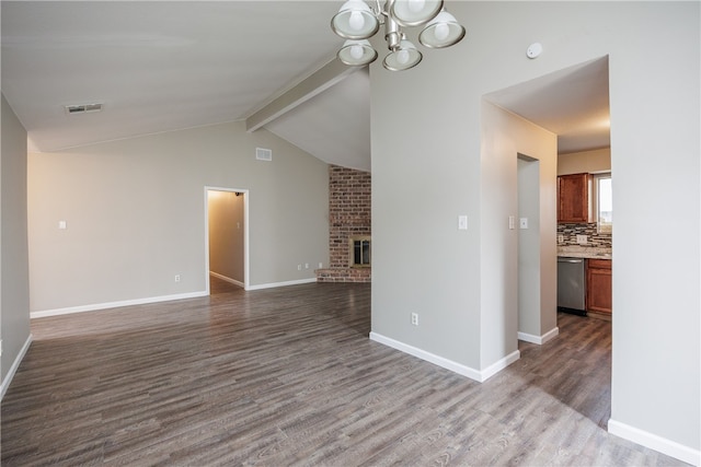 unfurnished living room with a brick fireplace, wood-type flooring, and vaulted ceiling with beams