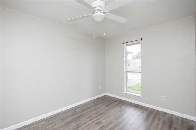 empty room featuring wood-type flooring, ceiling fan, and plenty of natural light