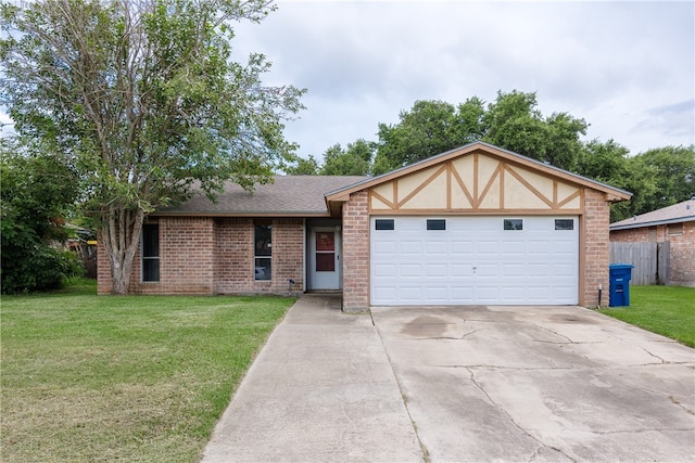 view of front facade with a garage and a front lawn