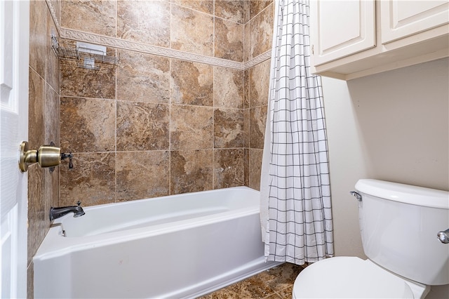 bathroom featuring shower / bath combo with shower curtain and toilet