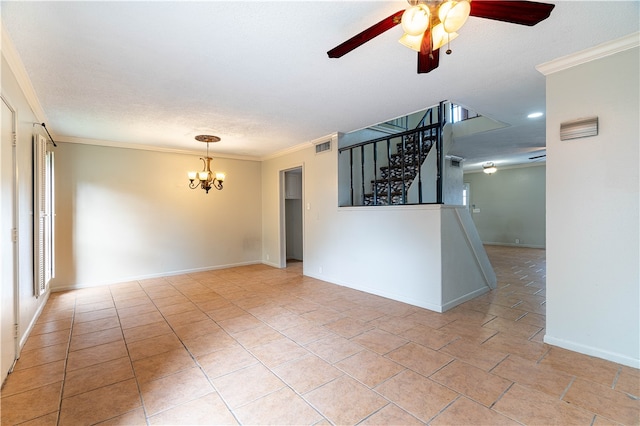 empty room with a textured ceiling, light tile patterned floors, ornamental molding, and ceiling fan with notable chandelier